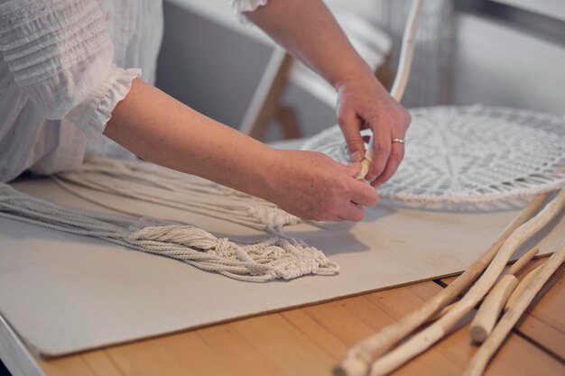 woman working custom macrame decor with tools creative desktop watched from hobby knitting macrame hand thread 941451 6851